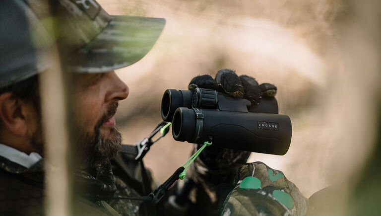 Hunter with the Bushnell Engage DX Binoculars in hand