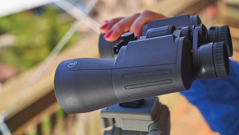 Woman holding the Bushnell Powerview 2 Binoculars