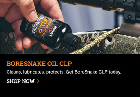 Person applying BoreSnake Oil CLP