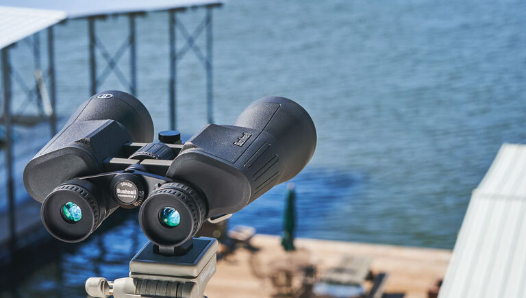 Bushnell Powerview 2 Binoculars on a stand at a waterfront